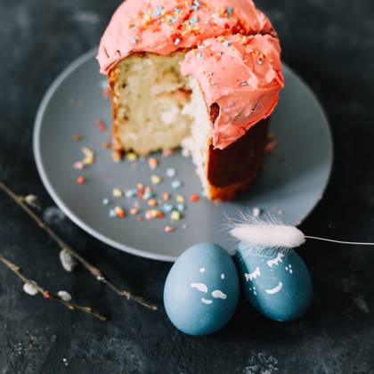 Plate with tasty Easter cake, eggs and willow branches on dark background Plate with tasty Easter cake, eggs and willow branches on dark background. High quality photo Copyright: x RECORD DATE NOT STATED