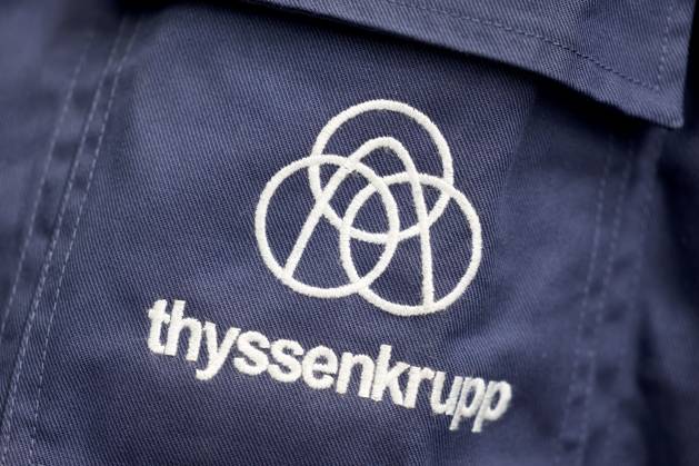 ThyssenKrupp Steel Werk Ferndorf ThyssenKrupp Steel invests in expansion of production capacities in Siegerland Production capacities for zinc magnesium products for the solar industry and further plant modernization ThyssenKrupp lettering and logo on a work jacket ThyssenKrupp Steel Werk Ferndorf on 18 06 2024 in Kreuztal Germany
