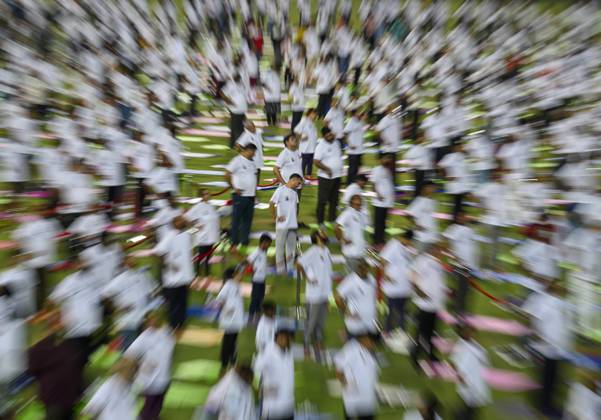 UN International Day of Yoga in Doha People perform in the yoga event organised by the Indian embassy in collaboration with Indian Cultural Centre and Indian Sports Centre at the Asian Town Cricket Stadium to mark the 10th UN International Day of Yoga in Doha, Qatar on June 21, 2024. DOHA Qatar Copyright: xNOUSHADx