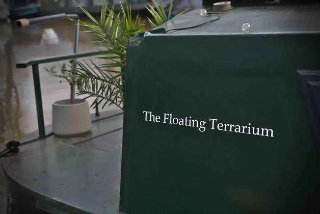 Love plants? Stay in London™s first live-in terrarium boat this summer Story from Jam Press (Terrarium Boat) Pictured: The Floating Terrarium. Love plants? Stay in London™s first live-in terrarium boat this summer Are you a plant lover? A water babe? Well, now you can take both to the next level with a stay on a ˜terrarium boat . Moored on a canal in Hackney, London, this life-size ecosystem is made for those who want to get close to nature. The 48.3 sq m boat is decked out with 150 verdant houseplants - making it a perfect live-in oasis. Terrariums are more commonly known to be small, sometimes big, glass enclosures filled with plants, stones and mosses. But this one is a floating, green sanctuary. The two-guest propert Copyright: xJamxPress @thefloatingterrarium