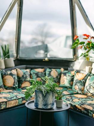 Love plants? Stay in London™s first live-in terrarium boat this summer Story from Jam Press (Terrarium Boat) Pictured: The living room. Love plants? Stay in London™s first live-in terrarium boat this summer Are you a plant lover? A water babe? Well, now you can take both to the next level with a stay on a ˜terrarium boat . Moored on a canal in Hackney, London, this life-size ecosystem is made for those who want to get close to nature. The 48.3 sq m boat is decked out with 150 verdant houseplants - making it a perfect live-in oasis. Terrariums are more commonly known to be small, sometimes big, glass enclosures filled with plants, stones and mosses. But this one is a floating, green sanctuary. The two-guest property is co Copyright: xJamxPress @thefloatingterrarium