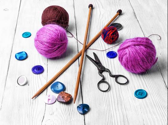 Close-up of tool knitting. banner with knitting wool and knitting needles and buttons ,model released, Symbolfoto