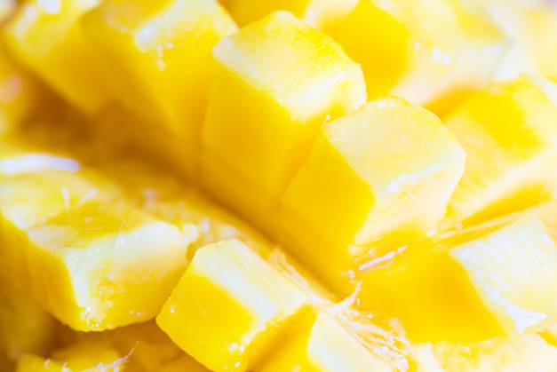 Close up view of ripe mango fruit sliced into cubes. Soft focus, can be used as food background ,model released, Symbolfoto