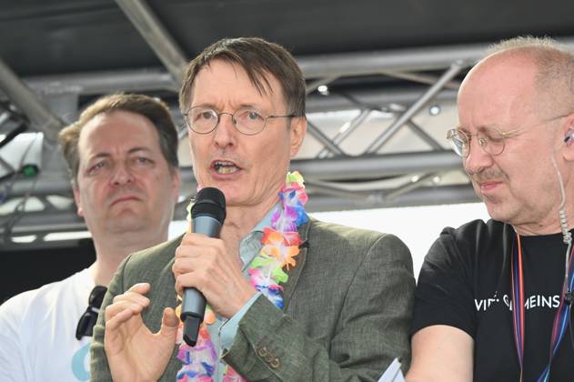 Politician Karl Lauterbach SPD , Federal Minister of Health as a participant in the Christopher Street Day CSD in Cologne Over 200 groups of lesbians and gays took part in the parade with this years motto For Human Rights - Many Together Strong They demonstrated for more social acceptance and legal equality for gays, lesbians, transgender a