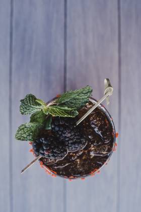 Refreshing blackberry cocktail with mint garnish. San Diego, California, United States R_QCYJ240711-1469489-01