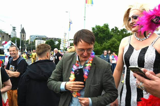 Politician Karl Lauterbach SPD , Federal Minister of Health as a participant in the Christopher Street Day CSD in Cologne Over 200 groups of lesbians and gays took part in the parade with this years motto For Human Rights - Many Together Strong They demonstrated for more social acceptance and legal equality for gays, lesbians, transgender a