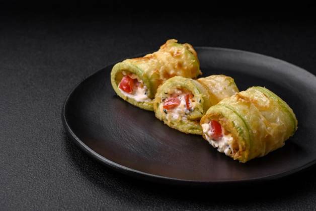  Delicious healthy vegetarian vegetable roll of zucchini, tomatoe, Delicious healthy vegetarian vegetable roll of zucchini, tomatoes, peppers and sauce with spices and herbs on a textured concrete background, Delicious healthy vegetarian vegetable roll of zucchini, tomatoes, peppers and sauce with spices and herbs on a textured concrete background, 20.09.2023, Copyright: xTan4ikx Panthermedia35909864.jpg