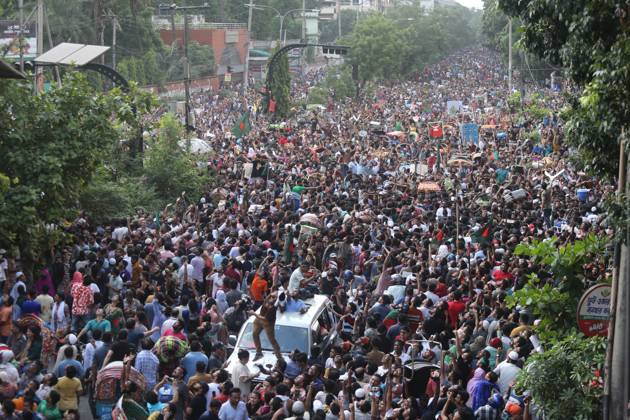 August 5, 2024, Dhaka, Wari, Bangladesh: Anti-government protestors celebrate in Shahbag near Dhaka university area in Dhaka on August 5, 2024. Protests in Bangladesh that began as student-led demonstrations against government hiring rules in July culminated on August 5, in the prime minister fleeing and the military announcing it would form an interim government.People gather to celebrate the fall of Bangladesh Prime Minister Sheikh Hasina after an intense clash between police, pro-government forces, and anti-Quota protesters in Dhaka, Bangladesh. Dhaka Bangladesh - ZUMAr336 20240805_zip_r336_034 Copyright: xHabiburxRahmanx