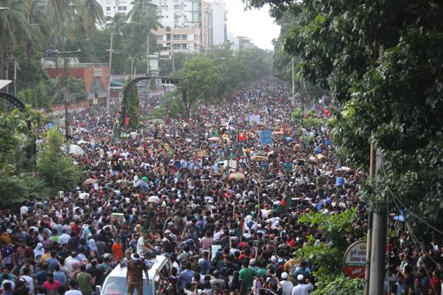 August 5, 2024, Dhaka, Wari, Bangladesh: Anti-government protestors celebrate in Shahbag near Dhaka university area in Dhaka on August 5, 2024. Protests in Bangladesh that began as student-led demonstrations against government hiring rules in July culminated on August 5, in the prime minister fleeing and the military announcing it would form an interim government.People gather to celebrate the fall of Bangladesh Prime Minister Sheikh Hasina after an intense clash between police, pro-government forces, and anti-Quota protesters in Dhaka, Bangladesh. Dhaka Bangladesh - ZUMAr336 20240805_zip_r336_036 Copyright: xHabiburxRahmanx