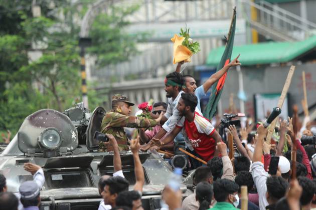 August 5, 2024, Dhaka, Wari, Bangladesh: Anti-government protestors celebrate in Shahbag near Dhaka university area in Dhaka on August 5, 2024. Protests in Bangladesh that began as student-led demonstrations against government hiring rules in July culminated on August 5, in the prime minister fleeing and the military announcing it would form an interim government.People gather to celebrate the fall of Bangladesh Prime Minister Sheikh Hasina after an intense clash between police, pro-government forces, and anti-Quota protesters in Dhaka, Bangladesh. Dhaka Bangladesh - ZUMAr336 20240805_zip_r336_057 Copyright: xHabiburxRahmanx