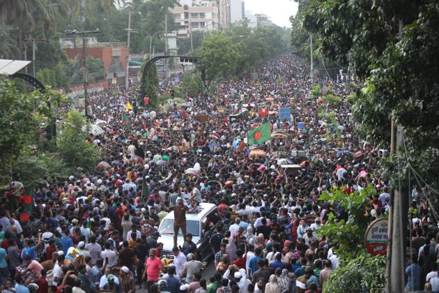 August 5, 2024, Dhaka, Wari, Bangladesh: Anti-government protestors celebrate in Shahbag near Dhaka university area in Dhaka on August 5, 2024. Protests in Bangladesh that began as student-led demonstrations against government hiring rules in July culminated on August 5, in the prime minister fleeing and the military announcing it would form an interim government.People gather to celebrate the fall of Bangladesh Prime Minister Sheikh Hasina after an intense clash between police, pro-government forces, and anti-Quota protesters in Dhaka, Bangladesh. Dhaka Bangladesh - ZUMAr336 20240805_zip_r336_065 Copyright: xHabiburxRahmanx