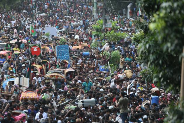 August 5, 2024, Dhaka, Wari, Bangladesh: Anti-government protestors celebrate in Shahbag near Dhaka university area in Dhaka on August 5, 2024. Protests in Bangladesh that began as student-led demonstrations against government hiring rules in July culminated on August 5, in the prime minister fleeing and the military announcing it would form an interim government.People gather to celebrate the fall of Bangladesh Prime Minister Sheikh Hasina after an intense clash between police, pro-government forces, and anti-Quota protesters in Dhaka, Bangladesh. Dhaka Bangladesh - ZUMAr336 20240805_zip_r336_070 Copyright: xHabiburxRahmanx