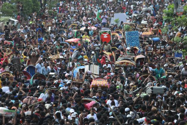 August 5, 2024, Dhaka, Wari, Bangladesh: Anti-government protestors celebrate in Shahbag near Dhaka university area in Dhaka on August 5, 2024. Protests in Bangladesh that began as student-led demonstrations against government hiring rules in July culminated on August 5, in the prime minister fleeing and the military announcing it would form an interim government.People gather to celebrate the fall of Bangladesh Prime Minister Sheikh Hasina after an intense clash between police, pro-government forces, and anti-Quota protesters in Dhaka, Bangladesh. Dhaka Bangladesh - ZUMAr336 20240805_zip_r336_071 Copyright: xHabiburxRahmanx