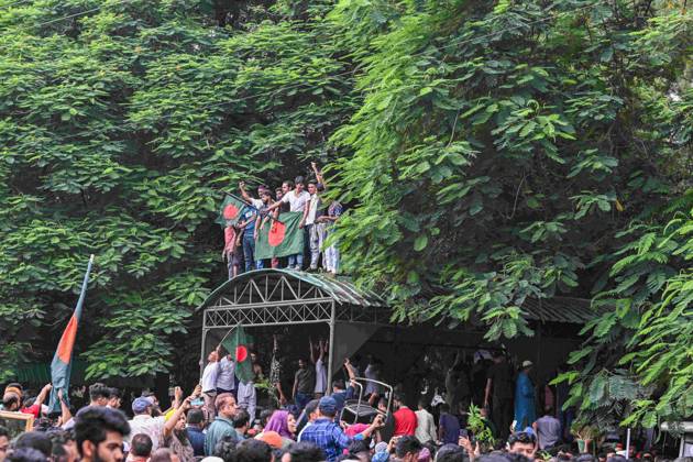 August 5, 2024, Dhaka, Bangladesh: Anti-government protestors are seen celebrating at the country s Prime Minister Sheikh Hasina s after she fled and resigned. Thousands of Bangladesh People celebrate the resignation of Bangladeshi Prime Minister Sheikh Hasina. Protests in Bangladesh that began in July for the abolition of the quota system in government jobs culminated on August 5, as Bangladesh military chief Gen. Waker-uz-Zaman announced a transitional government after Prime Minister Sheikh Hasina fled the country due to violent nationwide protests. Hundreds of people were killed and wounded during the protests since July, which first called for the abolition of quotas in government jobs and later the resignation of the Hasina, who had be - ZUMAs197 20240805_aaa_s197_149 Copyright: xZabedxHasnainxChowdhuryx