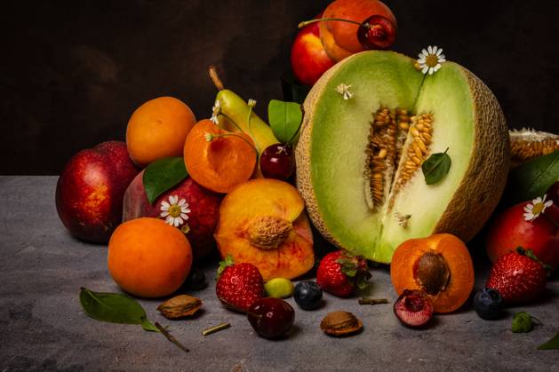 Still life view with melon, summer fruits and flowers Madrid, Community of Madrid, Spain CR_UAHZAF241025-1570557-01