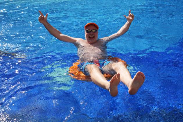 swimming in swimming pool model release available Egypt, 20241124, senior in swimming pool bathing, health conscious older man M:RY