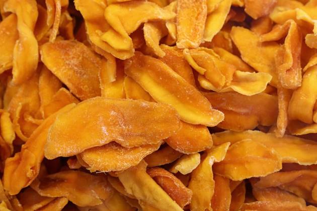  Dried mango slices forming a colorful and textured background, Close up view of dried mango slices showcasing vibrant color and intricate texture, creating an appealing visual for food and culinary themes, Close up view of dried mango slices showcasing vibrant color and intricate texture, creating an appealing visual for food and culinary themes, 17.11.2024, Copyright: xBreakingTheWallsx Panthermedia38315346.jpg