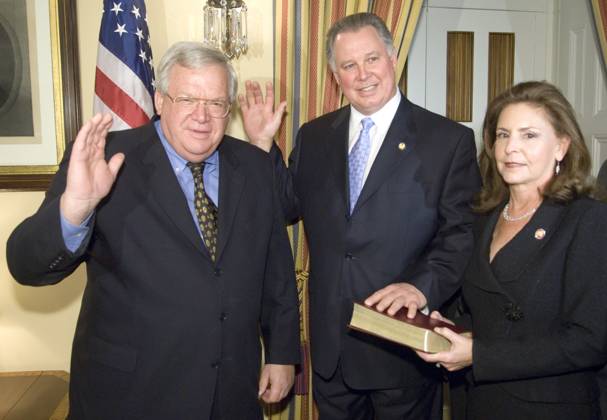 Hastert Sires Speaker of the House Dennis Hastert , R-Ill., left, participates in a mock swearing-in ceremony with incoming Rep.-elect Albio Sires, D-N.J., center, and his wife Adrienne Sires, Monday, Nov. 13, 2006, in Washington. Sires is filling the House seat of Bob Menendez for the balance of the Congressional term. Washington DC USA EDITORIAL USE ONLY Copyright: x x2006xRollxCallxPhotosx BillxClarkx rollcallpix034271