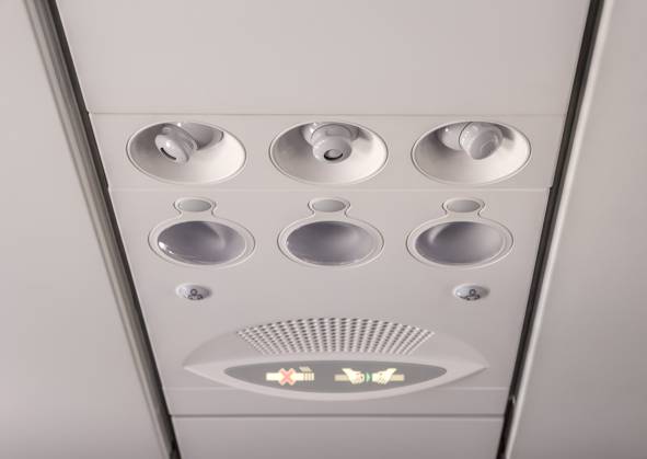 Adjustable lights and air conditioners overhead seat controls of a commercial aircraft in an airplane with no-smoking and seat belt on signs , 46760644.jpg, nobody, part, transport, inside, air, travel, transportation, panel, fly, flight, console, airplane, conditioner, sign, cabin, aircraft, plane, light, overhead, control, interior, aviation, conditioning, board, button, lamp, cool, seat, jet, ventilation, closeup, vent, smoke, ceiling, seating, safety, warning, no, plastic, aeroplane, airline, knob, detail, round, symbol, commuter, security, passenger, airliner, background RECORD DATE NOT STATED
