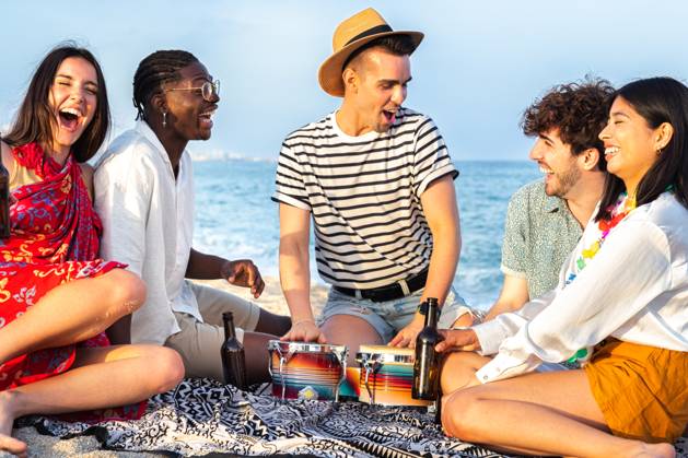 Group of multiracial friends having fun at the beach, laughing out loud, playing bongos and drinking beer together. Vacation and friendship concept., model released, , 47603782.jpg, beach, friends beer, picnic, party, toast, cheers, people, drink, african, black, bottle, having fun, sun, summer, group, hold, men, happy, festival, guy, travel, young, hispanic, hat, holidays, latina, sea, youth, fun, music, celebration, joy, alcohol, friendship, women, cool, weekend, beautiful, sand, female, outdoor, holiday, hangout, sitting, freedom, vacation, copy space RECORD DATE NOT STATED