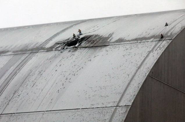 Russian drone hits Chornobyl shelter Rescuers work at the site where a Russian attack drone with an explosive warhead hits the New Safe Confinement at the Chornobyl Nuclear Power Plant in the Kyiv region, Ukraine, on January 14, 2025. The structure, put in place in 2016, protects the remains of Reactor 4 destroyed during the 1986 Chornobyl disaster. Kyiv region Ukraine  Copyright: xVolodymyrxTarasovx originalFilename: ukrinform-russiand250214_npVrd.jpg