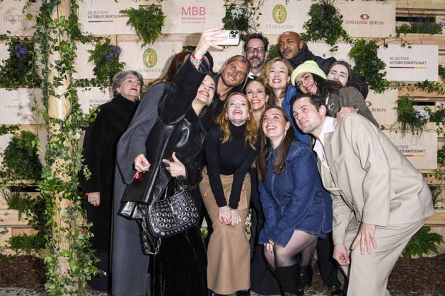 Emilia Schüle, Rurik Gislason, Karoline Herfurth, Dilara Aylin Ziem, Malick Bauer, Ilknur Boyraz and Samuel Schneider actress take cell phone photos as guests at the Medienboard Party at Holzmarkt in Berlin at the 75th Berlin International Film Festival on 15 02 2025 in Berlin Berlin Germany