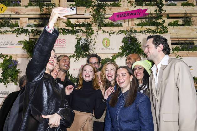 Emilia Schüle, Rurik Gislason, Karoline Herfurth, Dilara Aylin Ziem, Malick Bauer, Ilknur Boyraz and Samuel Schneider actress take cell phone photos as guests at the Medienboard Party at Holzmarkt in Berlin at the 75th Berlin International Film Festival on 15 02 2025 in Berlin Berlin Germany