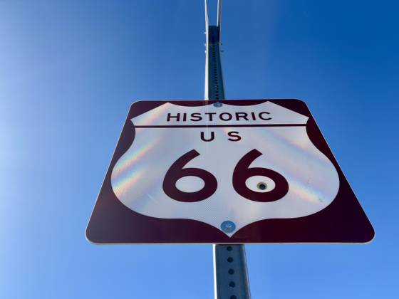 Historic Route 66 road sign against a clear blue sky in Arizona. Ash Fork, Arizona, United States R_RMYC250216-1649775-01