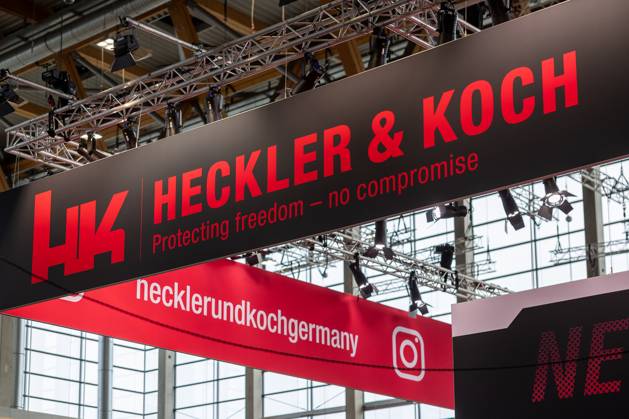 Enforce Tac 2025 International Trade Fair for Security and Defense, Nuremberg, 24 02 2025 Heckler Koch exhibition stand with large, illuminated company logo and the slogan Protecting freedom no compromise The company is a leading manufacturer of firearms for the military, police and security forces Nuremberg Dutzendteich Bavaria Germany 20250224-6V2A9900-M4000