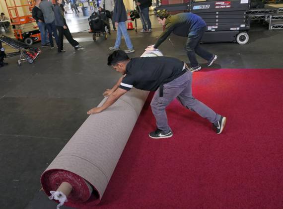Crew members roll out the red carpet in preparation for the 97th Academy Awards in the Hollywood section of Los Angeles, California on Wednesday, February 26, 2025. Oscar winners will be announced during an ABC live telecast on March 2.  LAP2025022601 JIMxRUYMEN