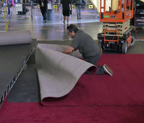 Crew members roll out the red carpet in preparation for the 97th Academy Awards in the Hollywood section of Los Angeles, California on Wednesday, February 26, 2025. Oscar winners will be announced during an ABC live telecast on March 2.  LAP2025022603 JIMxRUYMEN