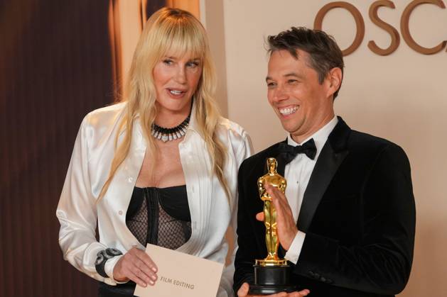 Sean Baker (R) celebrates backstage with Academy Awards presenter Daryl Hannah after winning the Oscar for film editing for Anora during the 97th Academy Awards in the Hollywood section of Los Angeles on Sunday, March 2, 2025.  LAP20250302122 PATxBENIC