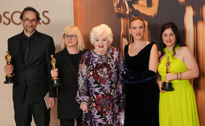Pierre-Olivier Persin (L), Stéphanie Guillon and Marilyne Scarselli (R) celebrate backstage with Academy Award award presenters Scarlett Johansson (2nd R) and June Squibb after winning the Oscar for makeup and hairstyling for The Substance during the 97th Academy Awards in the Hollywood section of Los Angeles on Sunday, March 2, 2025.  LAP20250302124 PATxBENIC