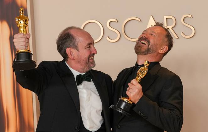 Nathan Crowley and Lee Sandales of Wicked celebrate backstage after winning the Oscar for best production design during the 97th Academy Awards in the Hollywood section of Los Angeles on Sunday, March 2, 2025.  LAP20250302125 PATxBENIC