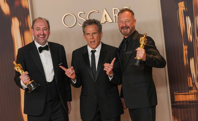 Nathan Crowley and Lee Sandales of Wicked celebrate backstage with Academy Award presenter Ben Stiller (C) after winning the Oscar for best production design during the 97th Academy Awards in the Hollywood section of Los Angeles on Sunday, March 2, 2025.  LAP20250302126 PATxBENIC