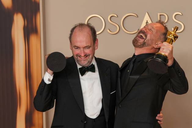 Nathan Crowley and Lee Sandales of Wicked celebrate backstage after winning the Oscar for best production design during the 97th Academy Awards in the Hollywood section of Los Angeles on Sunday, March 2, 2025.  LAP20250302127 PATxBENIC