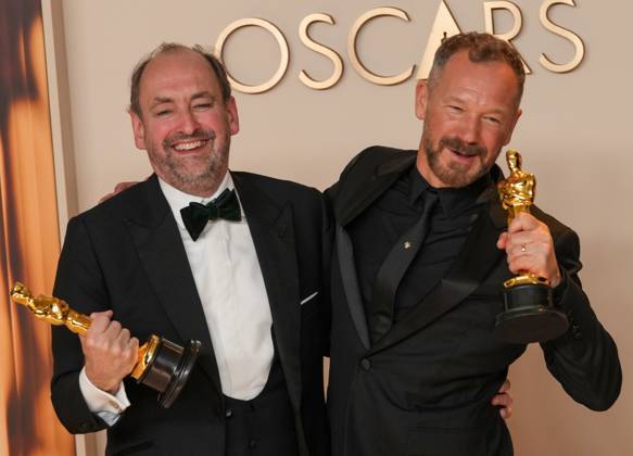 Nathan Crowley and Lee Sandales of Wicked celebrate backstage after winning the Oscar for best production design during the 97th Academy Awards in the Hollywood section of Los Angeles on Sunday, March 2, 2025.  LAP20250302128 PATxBENIC