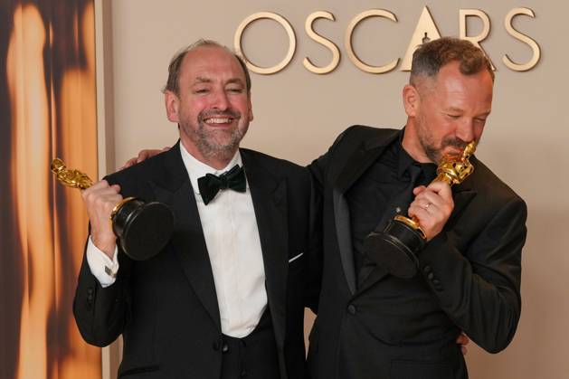 Nathan Crowley and Lee Sandales of Wicked celebrate backstage after winning the Oscar for best production design during the 97th Academy Awards in the Hollywood section of Los Angeles on Sunday, March 2, 2025.  LAP20250302129 PATxBENIC