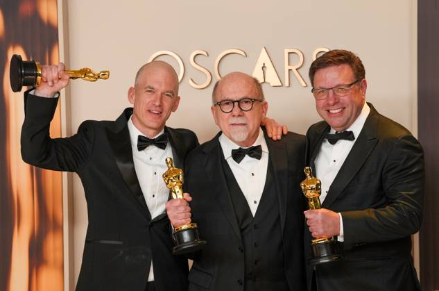 Gareth John, Richard King, and Ron Bartlett of Dune: Part Two celebrate backstage after winning the Oscar for best sound during the 97th Academy Awards in the Hollywood section of Los Angeles on Sunday, March 2, 2025.  LAP20250302135 PATxBENIC