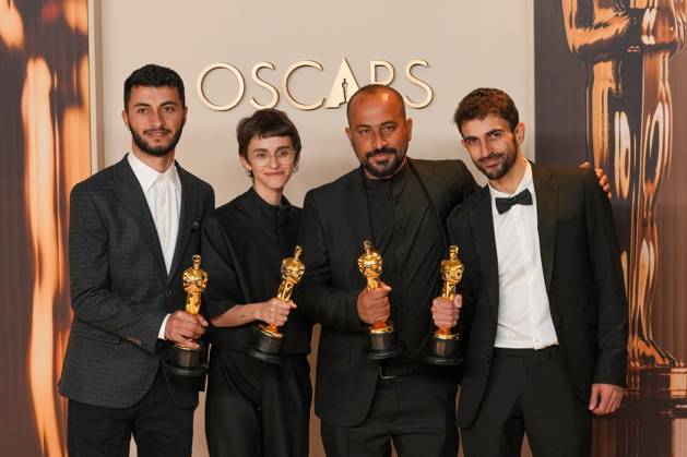 Basel Aero, Rachel Szar, Hamdan Ball, and Yuval Abraham of No Other Land celebrate backstage after winning the Oscar for best documentary feature film during the 97th Academy Awards in the Hollywood section of Los Angeles on Sunday, March 2, 2025.  LAP20250302140 PATxBENIC