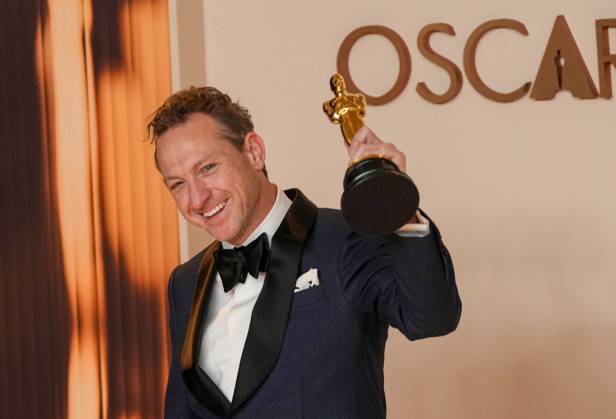 Lol Crawley of The Brutalist celebrates backstage after winning the Oscar for cinematography during the 97th Academy Awards in the Hollywood section of Los Angeles on Sunday, March 2, 2025.  LAP20250302145 PATxBENIC