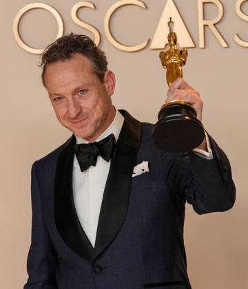 Lol Crawley of The Brutalist celebrates backstage after winning the Oscar for cinematography during the 97th Academy Awards in the Hollywood section of Los Angeles on Sunday, March 2, 2025.  LAP20250302147 PATxBENIC