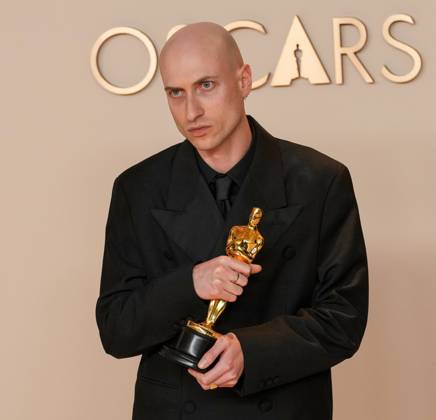 Daniel Blumberg of The Brutalist celebrates backstage after winning the Oscar for original score during the 97th Academy Awards in the Hollywood section of Los Angeles on Sunday, March 2, 2025.  LAP20250302151 PATxBENIC