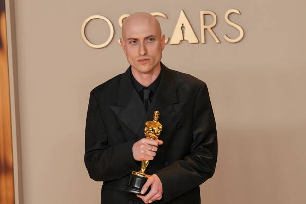 Daniel Blumberg of The Brutalist celebrates backstage after winning the Oscar for original score during the 97th Academy Awards in the Hollywood section of Los Angeles on Sunday, March 2, 2025.  LAP20250302152 PATxBENIC