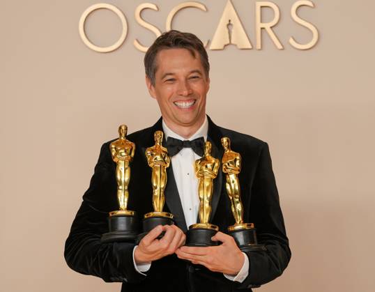 Sean Baker of Anora celebrates backstage after winning Oscars for best original screenplay, best film editing, best director, and best picture during the 97th Academy Awards in the Hollywood section of Los Angeles on Sunday, March 2, 2025.  LAP20250302167 PATxBENIC