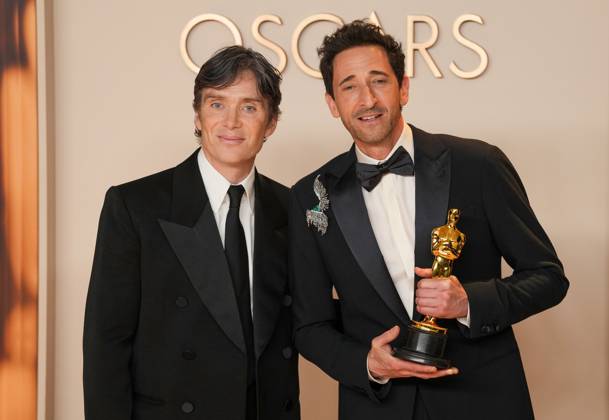 Cillian Murphy (L) joins best performance by an actor in a leading role Oscar winner Adrien Brody of The Brutalist celebrating backstage during the 97th Academy Awards in the Hollywood section of Los Angeles on Sunday, March 2, 2025.  LAP20250302169 PATxBENIC