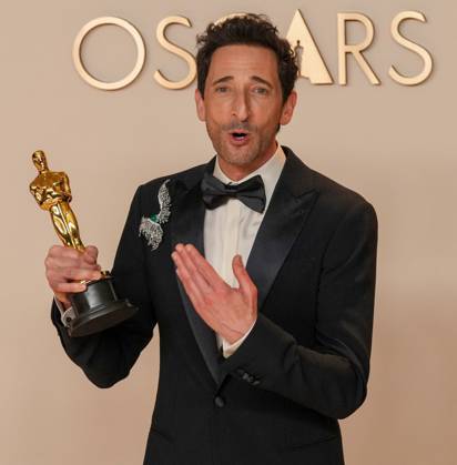 Best performance by an actor in a leading role Oscar winner Adrien Brody of The Brutalist celebrates backstage during the 97th Academy Awards in the Hollywood section of Los Angeles on Sunday, March 2, 2025.  LAP20250302172 PATxBENIC