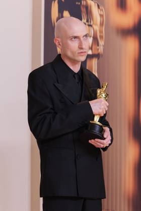 March 2, 2025, Hollywood, California, USA: Daniel Blumberg, winner of the Best Original Score for Ã¢â‚¬oeThe BrutalistÃ¢â‚¬Â, poses in the press room of the 97th Annual Academy Awards on Sunday March 2, 2025 at the Dolby Theater in Hollywood, California. BURT HARRIS BNS PI Hollywood USA - ZUMAp124 20250302_zaa_p124_423 Copyright: xBurtxHarrisx