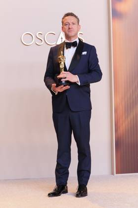March 2, 2025, Hollywood, California, USA: Lol Crawley, winner of the Best Cinematography for Ã¢â‚¬oeThe BrutalistÃ¢â‚¬Â, poses in the press room of the 97th Annual Academy Awards on Sunday March 2, 2025 at the Dolby Theater in Hollywood, California. BURT HARRIS BNS PI Hollywood USA - ZUMAp124 20250302_zaa_p124_439 Copyright: xBurtxHarrisx