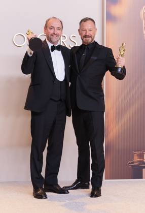 March 2, 2025, Hollywood, California, USA: Nathan Crowley (L) and Lee Sandales (R), winners of the Best Production Design award for Ã¢â‚¬oeWickedÃ¢â‚¬Â pose in the press room of the 97th Annual Academy Awards on Sunday March 2, 2025 at the Dolby Theater in Hollywood, California. BURT HARRIS BNS PI Hollywood USA - ZUMAp124 20250302_zaa_p124_474 Copyright: xBurtxHarrisx